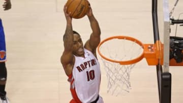 Apr 11, 2014; Toronto, Ontario, CAN; Toronto Raptors guard DeMar DeRozan (10) dunks against the New York Knicks at Air Canada Centre. The Knicks beat the Raptors 108-100. Mandatory Credit: Tom Szczerbowski-USA TODAY Sports