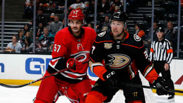 ANAHEIM, CA - DECEMBER 7: Nick Ritchie #37 of the Anaheim Ducks battles for position against Trevor van Riemsdyk #57 of the Carolina Hurricanes during the game on December 7, 2018 at Honda Center in Anaheim, California. (Photo by Debora Robinson/NHLI via Getty Images)