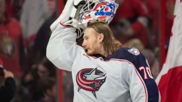 Jan 3, 2023; Ottawa, Ontario, CAN; Columbus Blue Jackets goalie Joonas Korpisalo (70) dons his helmet prior to start of game against the Ottawa Senators at the Canadian Tire Centre. Mandatory Credit: Marc DesRosiers-USA TODAY Sports