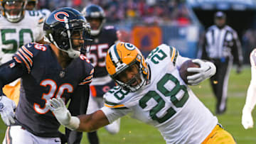 Dec 4, 2022; Chicago, Illinois, USA; Green Bay Packers running back AJ Dillon (28) scores a touchdown past Chicago Bears safety DeAndre Houston-Carson (36) during the second half at Soldier Field. Mandatory Credit: Matt Marton-USA TODAY Sports