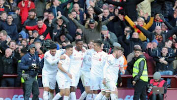 BIRMINGHAM, ENGLAND - FEBRUARY 14 : Divock Origi of Liverpool celebrates with his team-mates after scoring a goal to make it 0-4 during the Barclays Premier League match between Aston Villa and Liverpool at Villa Park on February 14, 2016 in Birmingham, England. (Photo by James Baylis - AMA/ via Getty Images)