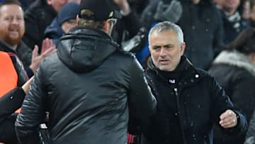 Manchester United's Portuguese manager Jose Mourinho (R) and Liverpool's German manager Jurgen Klopp shake hands after the English Premier League football match between Liverpool and Manchester United at Anfield in Liverpool, north west England on December 16, 2018. - Liverpool won the game 3-1. (Photo by Paul ELLIS / AFP) / RESTRICTED TO EDITORIAL USE. No use with unauthorized audio, video, data, fixture lists, club/league logos or 'live' services. Online in-match use limited to 120 images. An additional 40 images may be used in extra time. No video emulation. Social media in-match use limited to 120 images. An additional 40 images may be used in extra time. No use in betting publications, games or single club/league/player publications. / (Photo credit should read PAUL ELLIS/AFP via Getty Images)