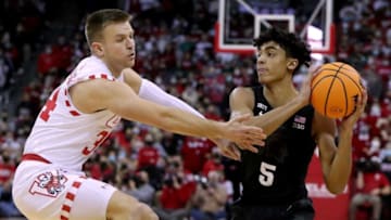 Wisconsin guard Brad Davison (34) pressures Michigan State guard Max Christie (5) during the first half of their game at the Kohl Center Friday, January 21, 2022 in Madison, Wis. Michigan State beat Wisconsin 86-74.Uwmen22 14