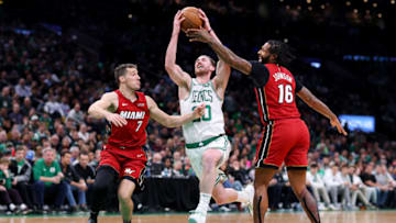 BOSTON, MASSACHUSETTS - APRIL 01: James Johnson #16 of the Miami Heat defends a shot from Gordon Hayward #20 of the Boston Celtics during the second half at TD Garden on April 01, 2019 in Boston, Massachusetts. The Celtics defeat the Heat 110-105. NOTE TO USER: User expressly acknowledges and agrees that, by downloading and or using this photograph, User is consenting to the terms and conditions of the Getty Images License Agreement. (Photo by Maddie Meyer/Getty Images)