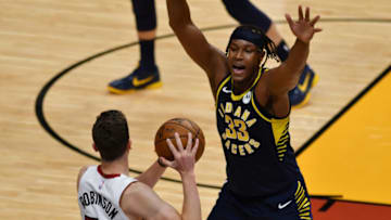 Mar 21, 2021; Miami, Florida, USA; Indiana Pacers center Myles Turner (33) defends Miami Heat guard Duncan Robinson (55) in the third quarter at American Airlines Arena. Mandatory Credit: Jim Rassol-USA TODAY Sports