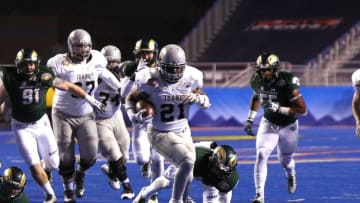 Dec 22, 2016; Boise, ID, USA; Idaho Vandals running back Isaiah Saunders (21) breaks away from the Colorado State Rams defense during the first half at the Idaho Potato Bowl at Albersons Stadium. Mandatory Credit: Brian Losness-USA TODAY Sports