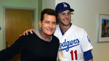 Sep 6, 2016; Los Angeles, CA, USA; Film actor Charlie Sheen (left) poses with Los Angeles Dodgers right fielder Josh Reddick (11) during a MLB game against the Arizona Diamondbacks at Dodger Stadium. Mandatory Credit: Kirby Lee-USA TODAY Sports
