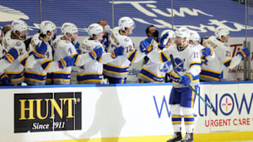 Feb 25, 2021; Buffalo, New York, USA; Buffalo Sabres center Riley Sheahan (15) celebrates his goal with teammates during the first period against the New Jersey Devils at KeyBank Center. Mandatory Credit: Timothy T. Ludwig-USA TODAY Sports