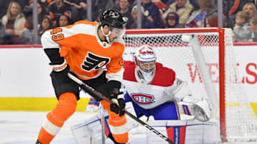 Mar 28, 2023; Philadelphia, Pennsylvania, USA; Philadelphia Flyers left wing Noah Cates (49) against Montreal Canadiens goaltender Cayden Primeau (30) at Wells Fargo Center. Mandatory Credit: Eric Hartline-USA TODAY Sports