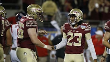 Sep 5, 2016; Orlando, FL, USA; Florida State Seminoles kicker Ricky Aguayo (23) is congratulated by Florida State Seminoles offensive lineman Keith Weeks (66) after he kicked a field goal during the second half at Camping World Stadium. Florida State Seminoles defeated the Mississippi Rebels 45-34. Mandatory Credit: Kim Klement-USA TODAY Sports