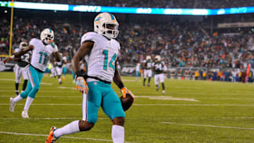 EAST RUTHERFORD, NJ - DECEMBER 17: Jarvis Landry #14 of the Miami Dolphins scores a touchdown against the New York Jets during the third quarter of the game at MetLife Stadium on December 17, 2016 in East Rutherford, New Jersey. (Photo by Alex Goodlett/Getty Images)