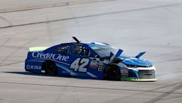 TALLADEGA, AL - OCTOBER 14: Kyle Larson, driver of the #42 Credit One Bank Chevrolet, spins on the backstretch during the Monster Energy NASCAR Cup Series 1000Bulbs.com 500 at Talladega Superspeedway on October 14, 2018 in Talladega, Alabama. (Photo by Brian Lawdermilk/Getty Images)