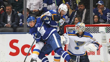 Alex Pietrangelo #27 of the St. Louis Blues battles against Kasperi Kapanen #24 of the Toronto Maple Leafs. (Photo by Claus Andersen/Getty Images)