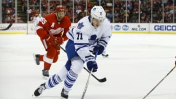 Oct 2, 2015; Detroit, MI, USA; aToronto Maple Leafs right wing Kasperi Kapanen (71) skates with the puck chased by Detroit Red Wings defenseman Niklas Kronwall (55) in the second period t Joe Louis Arena. Mandatory Credit: Rick Osentoski-USA TODAY Sports