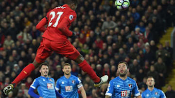 Liverpool's Belgian striker Divock Origi jumps to head their second goal during the English Premier League football match between Liverpool and Bournemouth at Anfield in Liverpool, north west England on April 5, 2017. / AFP PHOTO / PAUL ELLIS / RESTRICTED TO EDITORIAL USE. No use with unauthorized audio, video, data, fixture lists, club/league logos or 'live' services. Online in-match use limited to 75 images, no video emulation. No use in betting, games or single club/league/player publications. / (Photo credit should read PAUL ELLIS/AFP/Getty Images)