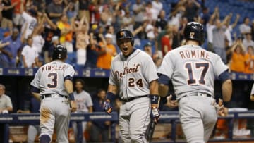 Jun 30, 2016; St. Petersburg, FL, USA; Detroit Tigers first baseman Miguel Cabrera (24) congratulates second baseman Ian Kinsler (3) and third baseman Andrew Romine (17) as they score during the ninth inning against the Tampa Bay Rays at Tropicana Field. Detroit Tigers defeated the Tampa Bay Rays 10-7. Mandatory Credit: Kim Klement-USA TODAY Sports