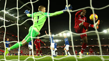 LIVERPOOL, ENGLAND - DECEMBER 02: Divock Origi of Liverpool shoots and misses as Jordan Pickford of Everton reaches for the ball during the Premier League match between Liverpool FC and Everton FC at Anfield on December 2, 2018 in Liverpool, United Kingdom. (Photo by Clive Brunskill/Getty Images)