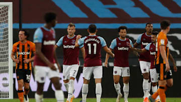West Ham United's Ukrainian striker Andriy Yarmolenko celebrates with teammates after scoring his team's third goal during the English League Cup third round football match between West Ham United and Hull City at The London Stadium, in east London on September 22, 2020. (Photo by Alastair Grant / POOL / AFP) / RESTRICTED TO EDITORIAL USE. No use with unauthorized audio, video, data, fixture lists, club/league logos or 'live' services. Online in-match use limited to 120 images. An additional 40 images may be used in extra time. No video emulation. Social media in-match use limited to 120 images. An additional 40 images may be used in extra time. No use in betting publications, games or single club/league/player publications. / (Photo by ALASTAIR GRANT/POOL/AFP via Getty Images)