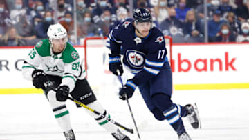 Winnipeg Jets, Adam Lowry (17); Dallas Stars, Thomas Harley (55). Mandatory Credit: James Carey Lauder-USA TODAY Sports