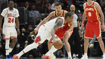 Feb 24, 2022; Chicago, Illinois, USA; Chicago Bulls forward DeMar DeRozan (11) dribbles against Atlanta Hawks guard Bogdan Bogdanovic (13) during the second half at the United Center. Mandatory Credit: Matt Marton-USA TODAY