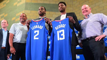 (FromR) Clippers owner Steve Ballmer, US basketball players Paul George and Kawhi Leonard, Clippers coach Doc Rivers and Clippers President of Basketball Operations Lawrence Frank pose during the introduction of Leonard and George as the new players of the Los Angeles Clippers during a press conference in Los Angeles on July 24, 2019. (Photo by Frederic J. BROWN / AFP) (Photo credit should read FREDERIC J. BROWN/AFP/Getty Images)
