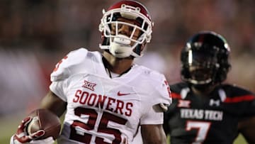 Oct 22, 2016; Lubbock, TX, USA; Oklahoma Sooners running back Joe Mixon (25) scores a touchdown in front of Texas Tech Red Raiders safety Jah