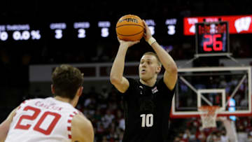 MADISON, WISCONSIN - JANUARY 21: Joey Hauser #10 of the Michigan State Spartans shoots a jump shot during the first half of the game against the Wisconsin Badgers at Kohl Center on January 21, 2022 in Madison, Wisconsin. Spartans defeated the Badgers 86-74. (Photo by John Fisher/Getty Images)