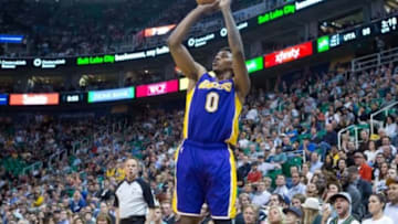 Apr 14, 2014; Salt Lake City, UT, USA; Los Angeles Lakers forward Nick Young (0) shoots during the second half against the Utah Jazz at EnergySolutions Arena. The Lakers won 119-104. Mandatory Credit: Russ Isabella-USA TODAY Sports