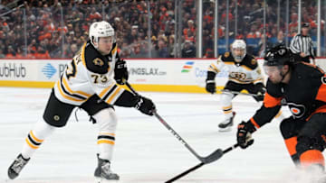 PHILADELPHIA, PA - JANUARY 16: Charlie McAvoy #73 of the Boston Bruins completes a pass against Ivan Provorov #9 of the Philadelphia Flyers on January 16, 2019 at the Wells Fargo Center in Philadelphia, Pennsylvania. (Photo by Len Redkoles/NHLI via Getty Images)