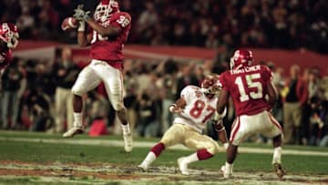 1 Jan 2001: Roy Williams #38 of the Oklahoma Sooners jumps to catch the ball as teammate J.T. Thatcher #15 and Robert Morgan #87 of the Florida State Seminoles are next to him during the Orange Bowl Game at the Pro Players Stadium in Miami, Florida. The Sooners defeated the Seminoles 13-2.Mandatory Credit: Eliot J. Schechter /Allsport