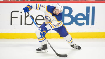 Jan 1,, 2023; Ottawa, Ontario, CAN; Buffalo Sabres defenseman Mattias Samuelsson (23) settles the puck in the third period against the Ottawa Senators at the Canadian Tire Centre. Mandatory Credit: Marc DesRosiers-USA TODAY Sports