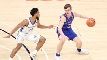 Christian Braun #2 of Kansas basketball dribbles the ball against the Kentucky Wildcats. (Photo by Andy Lyons/Getty Images)
