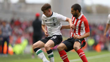 DUBLIN, IRELAND - AUGUST 5: Asier Villalibre of Athletic Club and Ben Woodburn of Liverpool battle for possession during the Pre Season Friendly match between Liverpool and Athletic Club at Aviva Stadium on August 5, 2017 in Dublin, Ireland. (Photo by Ian Walton/Getty Images)