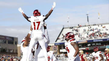 Nov 5, 2016; Boston, MA, USA; Louisville Cardinals wide receiver James Quick (17) is picked up by offensive lineman Geron Christian (74) after scoring a touchdown during the first quarter against the Boston College Eagles at Alumni Stadium. Mandatory Credit: Greg M. Cooper-USA TODAY Sports