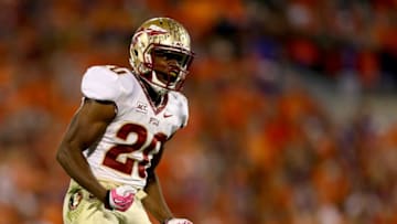 CLEMSON, SC - OCTOBER 19: Lamarcus Joyner #20 of the Florida State Seminoles reacts after a play against the Clemson Tigers during their game at Memorial Stadium on October 19, 2013 in Clemson, South Carolina. (Photo by Streeter Lecka/Getty Images)