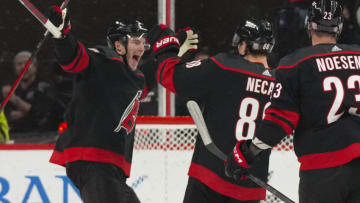 Jan 27, 2023; Raleigh, North Carolina, USA; Carolina Hurricanes center Martin Necas (88) celebrates his overtime goal with right wing Andrei Svechnikov (37) against the San Jose Sharks at PNC Arena. Mandatory Credit: James Guillory-USA TODAY Sports