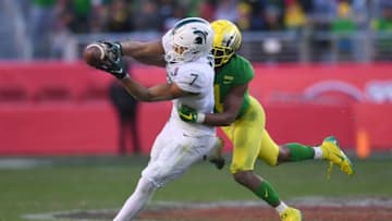 SANTA CLARA, CA - DECEMBER 31: Thomas Graham Jr. #4 of the Oregon Ducks breaks up the pass to Cody White #7 of the Michigan State Spartans on fourth down late in the fourth quarter of the Redbox Bowl at Levi's Stadium on December 31, 2018 in Santa Clara, California. (Photo by Thearon W. Henderson/Getty Images)