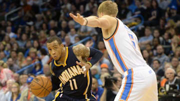 Feb 19, 2016; Oklahoma City, OK, USA; Indiana Pacers guard Monta Ellis (11) drives to the basket in front of Oklahoma City Thunder forward Kyle Singler (5) during the third quarter at Chesapeake Energy Arena. Mandatory Credit: Mark D. Smith-USA TODAY Sports