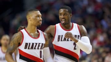 Jan 10, 2015; Portland, OR, USA; Portland Trail Blazers guard Damian Lillard (0) and guard Wesley Matthews (2) talks after a timeout during at Moda Center at the Rose Quarter. Mandatory Credit: Jaime Valdez-USA TODAY Sports