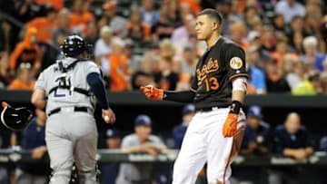 Sep 16, 2016; Baltimore, MD, USA; Baltimore Orioles third baseman Manny Machado (13) throws his helmet after striking out to end the third inning against the Tampa Bay Rays at Oriole Park at Camden Yards. Mandatory Credit: Evan Habeeb-USA TODAY Sports