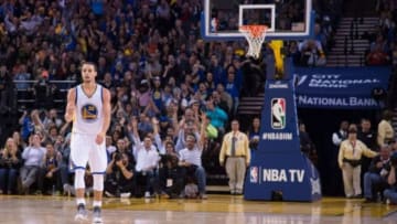 February 4, 2015; Oakland, CA, USA; Golden State Warriors guard Stephen Curry (30) celebrates during the fourth quarter against the Dallas Mavericks at Oracle Arena. The Warriors defeated the Mavericks 128-114. Mandatory Credit: Kyle Terada-USA TODAY Sports