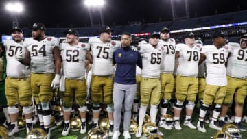 JACKSONVILLE, FL - DECEMBER 30: Head Coach Marcus Freeman of the Notre Dame Fighting Irish celebrates with his team after the game against the South Carolina Gamecocks at the 78th annual TaxSlayer Gator Bowl at TIAA Bank Field on January 2, 2021 in Jacksonvile, Florida. The Fighting Irish defeated The Gamecocks 45 to 38. (Photo by Don Juan Moore/Getty Images)