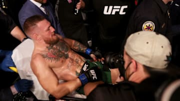 LAS VEGAS, NEVADA - JULY 10: Conor McGregor of Ireland is carried out of the arena on a stretcher after injuring his ankle in the first round of his lightweight bout against Dustin Poirier during UFC 264: Poirier v McGregor 3 at T-Mobile Arena on July 10, 2021 in Las Vegas, Nevada. (Photo by Stacy Revere/Getty Images)