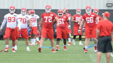 Jun 17, 2014; Kansas City, MO, USA; Kansas City Chiefs defensive lineman Kona Schwenke (93) and tackle Eric Fisher (72) run drills during the Kansas City Chiefs minicamp at University of Kansas Hospital Training Complex. Mandatory Credit: Denny Medley-USA TODAY Sports