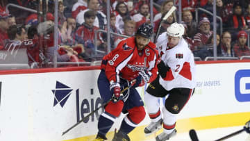 Jan 1, 2017; Washington, DC, USA; Washington Capitals left wing Alex Ovechkin (8) battles for the puck with Ottawa Senators defenseman Dion Phaneuf (2) during the first period at Verizon Center. Mandatory Credit: Amber Searls-USA TODAY Sports