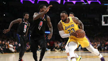 LOS ANGELES, CALIFORNIA - MARCH 04: LeBron James #23 of the Los Angeles Lakers dribbles past JaMychal Green #4 of the Los Angeles Clippers during the second half of a game against the Los Angeles Clippers at Staples Center on March 04, 2019 in Los Angeles, California. The Los Angeles Clippers defeated the Los Angeles Lakers 113-105. (Photo by Sean M. Haffey/Getty Images)