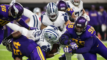 Dec 1, 2016; Minneapolis, MN, USA; Dallas Cowboys running back Ezekiel Elliott (21) is tackled by Minnesota Vikings linebacker Eric Kendricks (54) and defensive tackle Linval Joseph (98) during the second quarter at U.S. Bank Stadium. Mandatory Credit: Brace Hemmelgarn-USA TODAY Sports