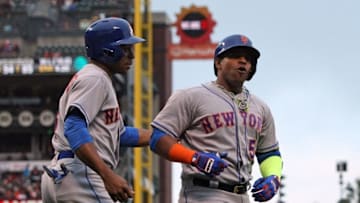 Aug 21, 2016; San Francisco, CA, USA; New York Mets center fielder Curtis Granderson (3) left fielder Yoenis Cespedes (52) after his two run RBI home run against the San Francisco Giants in the seventh inning of their MLB baseball game at AT&T Park. Mandatory Credit: Lance Iversen-USA TODAY Sports