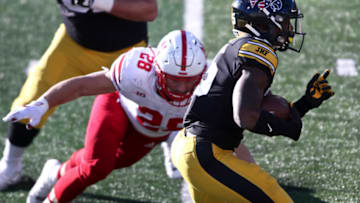 IOWA CITY, IOWA- NOVEMBER 27:Running back Tyler Goodson #15 of the Iowa Hawkeyes runs up the field during the second half in front of linebacker Luke Reimer #28 of the Nebraska Cornhuskers at Kinnick Stadium on November 27, 2020 in Iowa City, Iowa. (Photo by Matthew Holst/Getty Images)