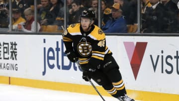 BOSTON, MA - DECEMBER 07: Boston Bruins left defenseman Matt Grzelcyk (48) skates up ice during a game between the Boston Bruins and the Phoenix Coyotes on December 7, 2017, at TD Garden in Boston, Massachusetts. The Bruins defeated the Coyotes 6-1. (Photo by Fred Kfoury III/Icon Sportswire via Getty Images)